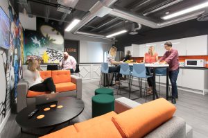 Image of office with industrial materials - lighting and exposed pipes