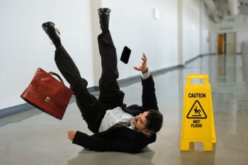 Man slipping wet floor