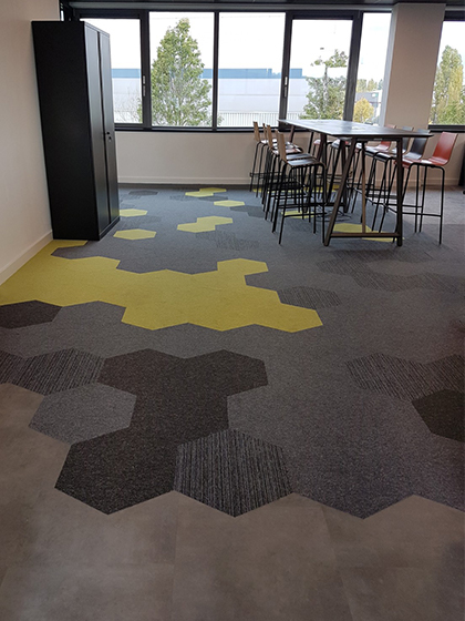 Hexagon carpet tiles in office space