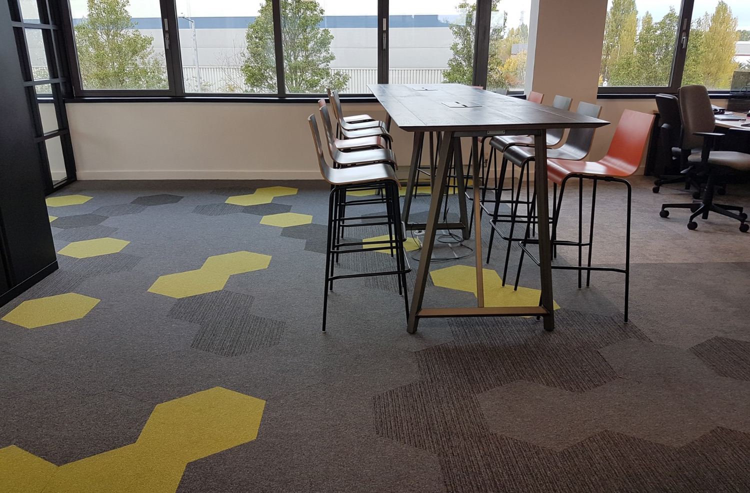 Hexagonal floor tiles. Hexagon carpet tiles in office design